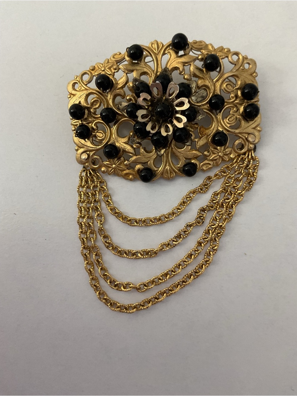 Vintage Gold-Tone Filigree Broach with Black Stones and a Multi-Strand chain
